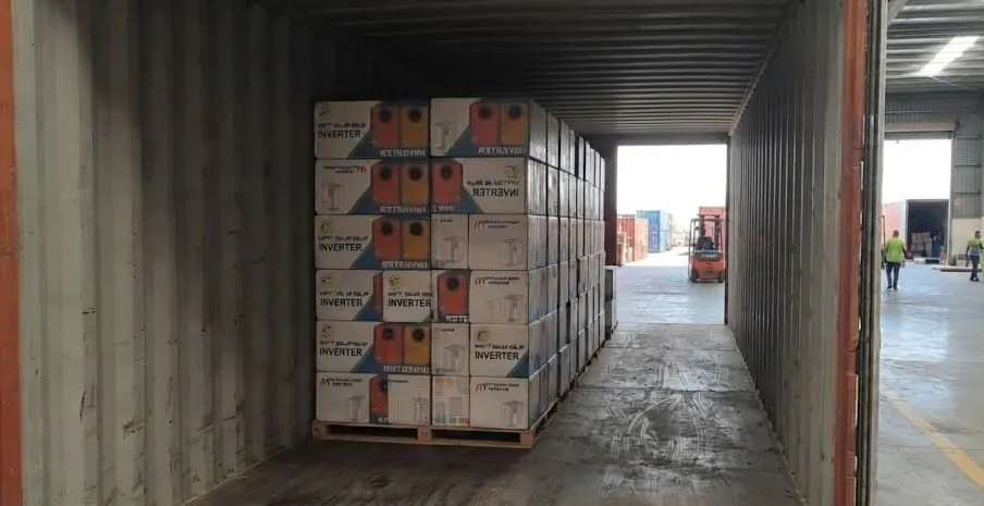 S3 Solar inverters being unloaded from a shipping container