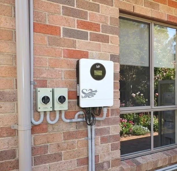 S3 Solar IP21 hybrid inverter (10.2 kW) on a home exterior at dusk